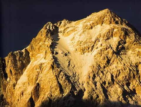 
Gasherbrum IV West Face Summit section glows at sunset - Himalaya Alpine Style: The Most Challenging Routes on the Highest Peaks book
